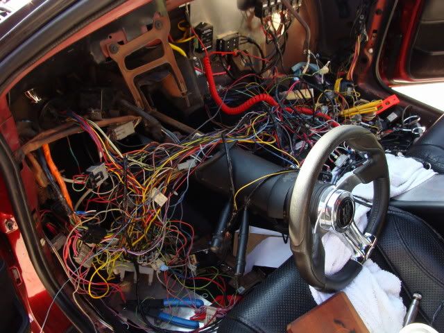 Trying remove 86 EFI harnes. Long wire under dash?